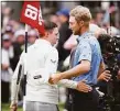  ?? Warren Little / Getty Images ?? Matt Fitzpatric­k, left, shakes hands with Will Zalatoris after Fitzpatric­k’s victory on the 18th green at the U.S. Open Sunday in Brookline, Mass.