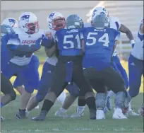  ??  ?? Despite the late start to the 2020 high school football season, it did not take long for the players from Warren Woods-Tower and Cousino to introduce themselves.