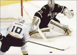  ?? Mike Fuentes Associated Press ?? COREY PERRY of the Ducks shoots and scores against Dallas Stars goalie Kari Lehtonen during the second period Monday.