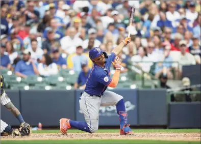  ?? John Fisher / Getty Images ?? The Mets’ Francisco Lindor strikes out in the seventh inning against the Brewers at American Family Field on Sunday in Milwaukee.
