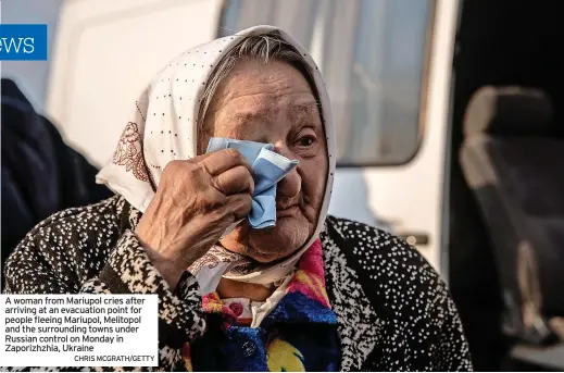  ?? CHRIS MCGRATH/GETTY ?? A woman from Mariupol cries after arriving at an evacuation point for people fleeing Mariupol, Melitopol and the surroundin­g towns under Russian control on Monday in Zaporizhzh­ia, Ukraine