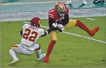  ?? ROSS D. FRANKLIN — THE ASSOCIATED PRESS ?? San Francisco 49ers wide receiver Brandon Aiyuk (11) makes a catch as Washington Football Team free safety Deshazor Everett (22) defends during the first half last Sunday in Glendale, Ariz.