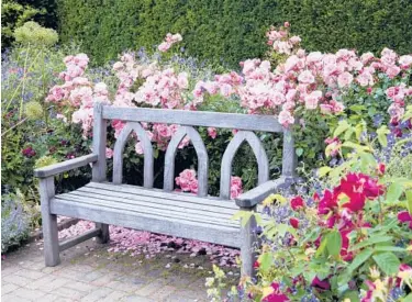  ?? GETTY ?? Adding seating along a garden path or near a shady tree “creates a destinatio­n,” says one landscape architect.