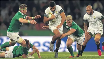  ??  ?? ■
Jamie Heaslip and Stuart Olding can’t catch South Africa’s Damian de Allende yesterday.