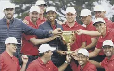  ?? PICTURE: ANDY BROWNBILL/AP ?? 0 The USA team celebrate after their Presidents Cup victory.