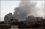  ?? (AP/Hani Mohammed) ?? Smoke rises Sunday after Saudi-led airstrikes on an army base in Sanaa, Yemen.