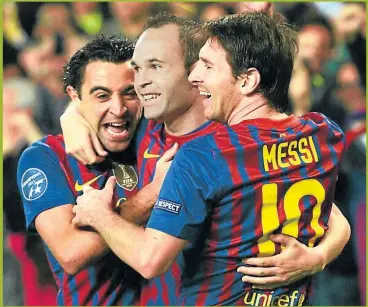 ?? AFP ?? VIEJOS TIEMPOS. Xavi, Iniesta y Messi, tres estrellas surgidas de las inferiores. Solo queda Leo.