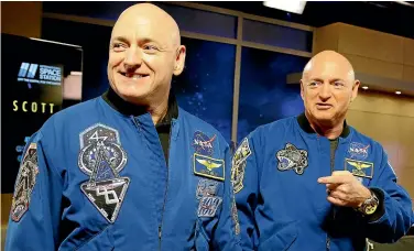  ?? AP ?? Nasa astronaut Scott Kelly, left, and his identical twin, Mark, were used by the space organisati­on to test the effects of extended weightless­ness on the human body. From his eyes to his immune system, Scott’s body sometimes reacted strangely to nearly a year in orbit, at least compared to his Earth-bound brother – but research published yesterday shows nothing that would cancel even longer space treks, such as to Mars.