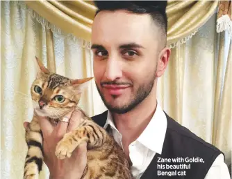  ??  ?? Zane with Goldie, his beautiful Bengal cat