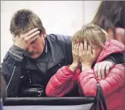  ?? Anatoly Maltsev European Pressphoto Agency ?? IN ST. PETERSBURG, Russia, relatives of passengers grieve. The tourist charter was headed back to the city from the Red Sea resort of Sharm el Sheik.