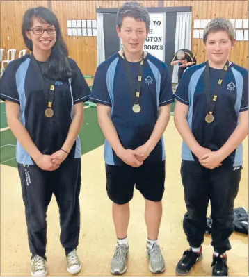  ??  ?? Bowling brilliance: From left, Aotea College’s Latisha Tuia, Seamus Curtin and Bradley Down with their medals at the College Sport Wellington indoor bowls champs.