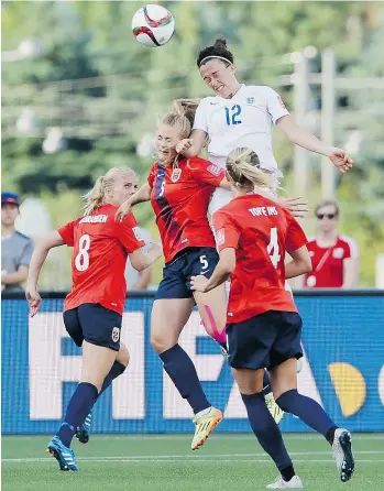  ?? SEAN KILPATRICK/THE CANADIAN PRESS ?? England’s Lucy Bronze goes up for a ball against Norway’s Lisa-Marie Karlseng Utland, centre, as Solveig Gulbrandse­n, left, and Gry Tofte Ims look on during England’s 2-1 win Monday in Ottawa.