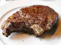  ?? Melissa Phillip / Houston Chronicle file ?? Tax lawyers and accountant­s are saying a closer read shows that deductions for client meal expenses, like a dry aged bone-in ribeye, may no longer be allowed.