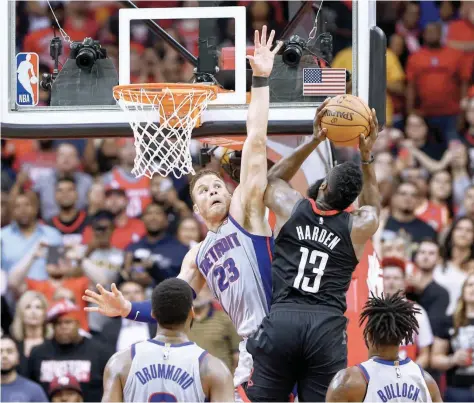  ?? — USA Today Sports ?? Detroit Pistons’ Blake Griffin (23) drives with the ball as Houston Rockets guard James Harden (13) defends during the third quarter at Toyota Center.