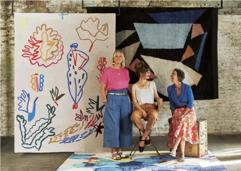  ??  ?? Above War Office pine, from £212 per sq m, Woodworks by Ted Todd. Right (From left) Sophie Abbott, Lauri Hopkins and Becky Blair with their rug designs for Habitat (clockwise from left): Undercliff, £400, Nightswim, £500, and Blue Rocks, £450, all 170 x 240cm