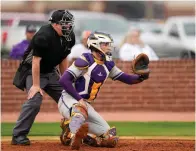  ?? (Photo courtesy of Gameday) ?? Ashdown catcher Caleb Blankenshi­p and home plate umpire Kyle Slayton kneel waiting on the pitch from a Panther pitcher Thursday against Longview in Texas High’s Border Battle baseball tournament at Tiger Field. Ashdown edged the Lobos, 8-7, in the only game completed before the rain forced postponeme­nt of the event until today at Longview, which has a turf field.