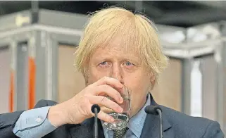  ?? /Reuters ?? Thirsting for leadership: British Prime Minister Boris Johnson drinks water as he delivers a speech during his visit to Dudley College of Technology in Dudley in June.