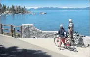  ?? JASON BEAN — THE RENO GAZETTE-JOURNAL VIA AP ?? Enjoy the view of Sand Harbor while riding the Tahoe East Shore Trail in Incline Village. The 3-mile-long bicycle and pedestrian trail was completed in 2019.