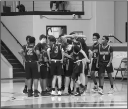  ?? Photo by Alexis Meeks ?? The Malvern 8th grade Cubs huddle up during a timeout