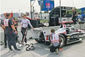  ?? AP PHOTO/DAN GELSTON ?? Tennessee native and two-time IndyCar Series champion Josef Newgarden leans on his car before taking a ceremonial pace lap Friday in Nashville.