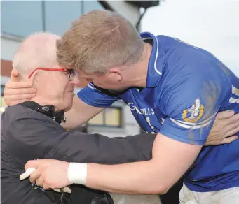  ??  ?? We did it...Noel and Brian Berrill celebrate Naomh Mairtin’s victory over the Dreadnots in the Cardinal O’Donnell Cup Final at The Grove, Castlebell­ingham recently.