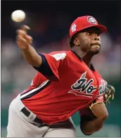  ?? AP - Susan Walsh ?? World Team pitcher Touki Toussaint, of the Atlanta Braves, works against the U.S. Team duirng Sunday’s All-Star Futures Game at Nationals Park in Washington.
