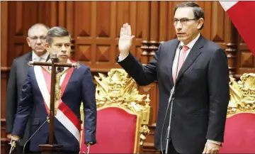  ??  ?? Vizcarra is sworn in as Peru’s president at the Congress building in Lima, Peru. — Reuters photo