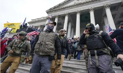  ?? Photograph: Manuel Balce Ceneta/AP ?? Members of the Oath Keepers on the steps of the US Capitol in Washington on 6 January 2021.