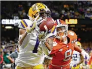  ?? ASSOCIATED PRESS ?? LSU wide receiver Ja’marr Chase, here catching a TD pass against Clemson, would reunite with his former college QB, Joe Burrow, if the Bengals draft him.