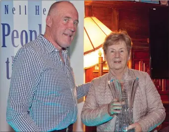  ??  ?? Joe Healy presents the award to joint-Community Support Person of the Year, Margaret Kavanagh.