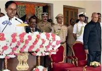  ?? PTI ?? K Chandrashe­kar Rao being administer­ed the oath of office as Governor ESL Narasimhan looks on in Hyderabad. —