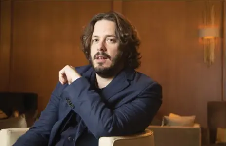  ?? BERNARD WEIL/TORONTO STAR ?? Baby Driver director Edgar Wright relaxes at the Ritz-Carlton Hotel. “I’d like to do a franchise movie if I thought I could make it my own,” he says.