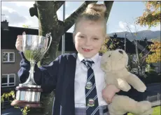  ?? 15_MOD42DM7_poetry ?? Eva Bisp, 7, Bun-sgoil Achadh na Creige, (Rockfield, Oban), won the 7-8 years learners singing competitio­n, with help from Oscar the Mòd dog.