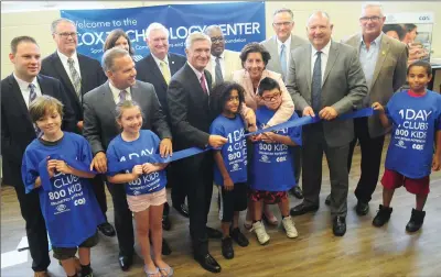  ?? Photo by Ernest A. Brown ?? State and local leaders including Cumberland State Rep. Ryan Pearson, Lincoln Town Administra­tor T. Joseph Almond, Cumberland Mayor Bill Murray, and Woonsocket/Cumberland State Rep. Roger Picard and other officials join Congressma­n David Cicilline, Cox...