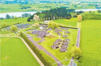  ??  ?? Aerial view of the Lakeside Spa & Resort in Karapiro; the reception and admin building; the facility has a heated indoor swimming pool.