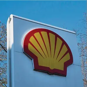  ?? — AP ?? Shell sale: The Shell logo at a petrol station in London. Royal Dutch Shell is said to be planning to sell a stake in two Dutch offshore wind-farm projects.