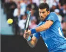  ?? REUTERS ?? NOVAK DJOKOVIC, who admitted he had been feeling under the weather for the last few days, needed more than four hours on Rod Laver Arena to subdue qualifier Dino Prizmic 6-2 6-7(5) 6-3 6-4.