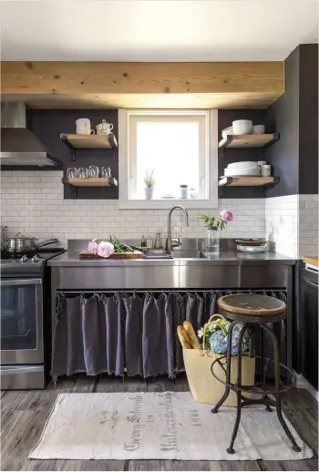  ??  ?? THIS PAGE A bird’s nest is displayed in an open drawer in a corner of the dining room. The kitchen looks more contempora­ry than the rest of the house, but metro tiles and antique linen curtains complement the overall aesthetic.
LEFT The glazed cabinet...