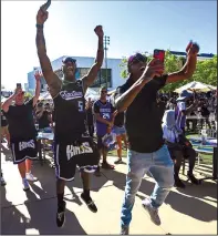  ?? PAUL KITAGAKI JR./TRIBUNE NEWS SERVICE ?? Sacramento Kings fans Josh Jones and James Cross celebrate Thursday during a draft party at Downtown Commons in Sacramento.