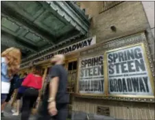  ?? AP PHOTO/RICHARD DREW ?? People pass the Walter Kerr Theater, home to the Broadway show “Springstee­n on Broadway,” in New York’s Theater District Friday.