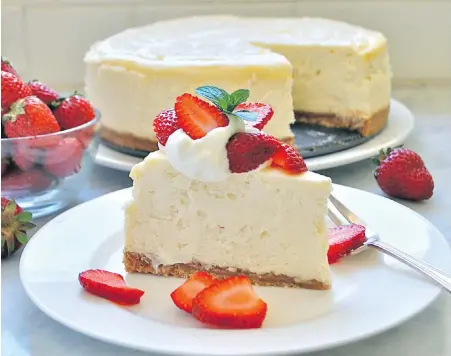 ??  ?? Rich and creamy New York-style cheesecake adorned with fresh, local strawberri­es.