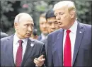  ?? AP ?? U.S. President Donald Trump and Russia’s President Vladimir Putin talk at the APEC Summit in Vietnam on Saturday.