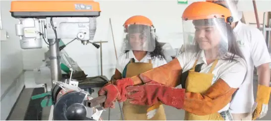  ?? PHOTOGRAPH COURTESY OF UNESCO-UNEVOC YOUNG women in Mexico attend a welding workshop. ??