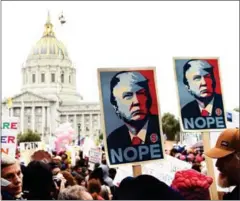  ?? JOSH EDELSON/AFP ?? Thousands of people gather at City Hall to protest President Donald Trump and to show support for women’s rights, in San Francisco, on Saturday.