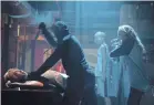  ?? MICHELE K. SHORT ?? Tree (Jessica Rothe, far right) defends Ryan (Phi Vu, far left) in “Happy Death Day 2U.”