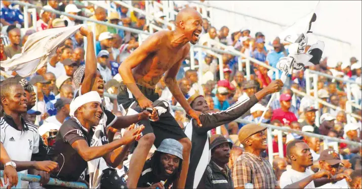  ??  ?? RAW EMOTIONS . . . Augustine Moyo, a former journalist with The Sunday Mail, who is now the spokesman of the Zimbabwe National Roads Administra­tion, shows his boundless joy as he celebrates the equaliser scored by his beloved Highlander­s in their...