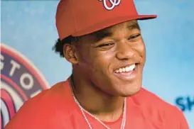 ?? AP PATRICK SEMANSKY/ ?? Elijah Green, the Washington Nationals 2022 first-round draft pick, speaks with members of the media on July 29. A club official called Green “The Monster” after he sent a homer far up the netting behind one field in a spring training workout Saturday afternoon.
