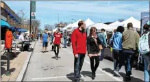  ?? ?? Visitors explore the Downtown Glenside Arts Festival in 2018.