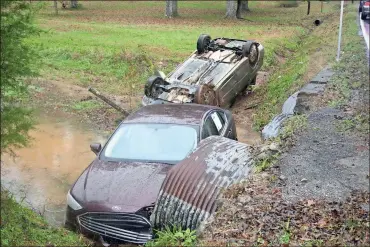  ?? / John Popham ?? According to Floyd Count Pfc. Corey Wright, the drivers involved in a wreck on Boyd Valley Road were driving too fast for conditions Wednesday afternoon and left the roadway landing in a shallow creek.