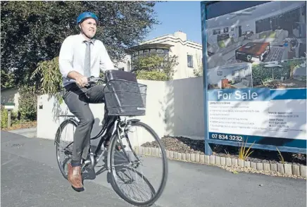  ?? Photo: FAIRFAX NZ ?? On yer bike: Jason Penny is a real estate agent for Bayleys. He rides a bike to and from his appointmen­ts.